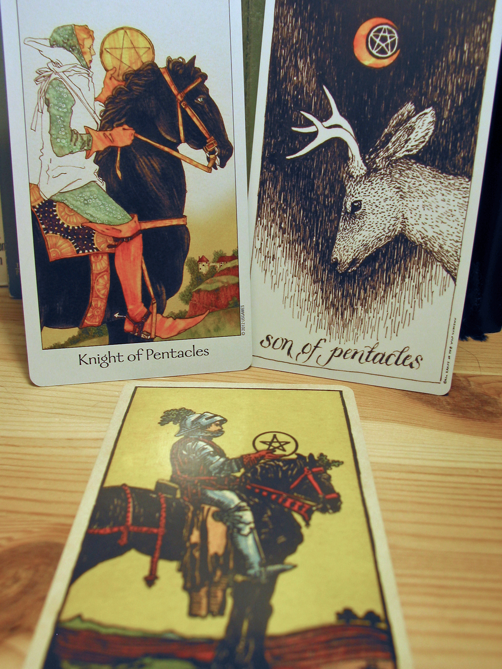 Knight of Pentacles. Dreaming Way Tarot, Wild Unknown Tarot, Smith-Waite Centennial Deck.